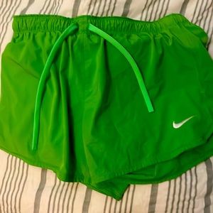 These are Nike shorts they are lime green and they are a size medium